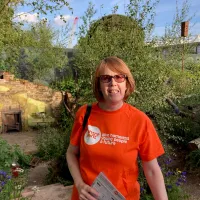 Woman smiling at camera in garden