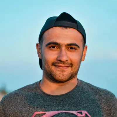Young man looking at camera smiling