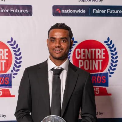 Young man smiling and looking at camera